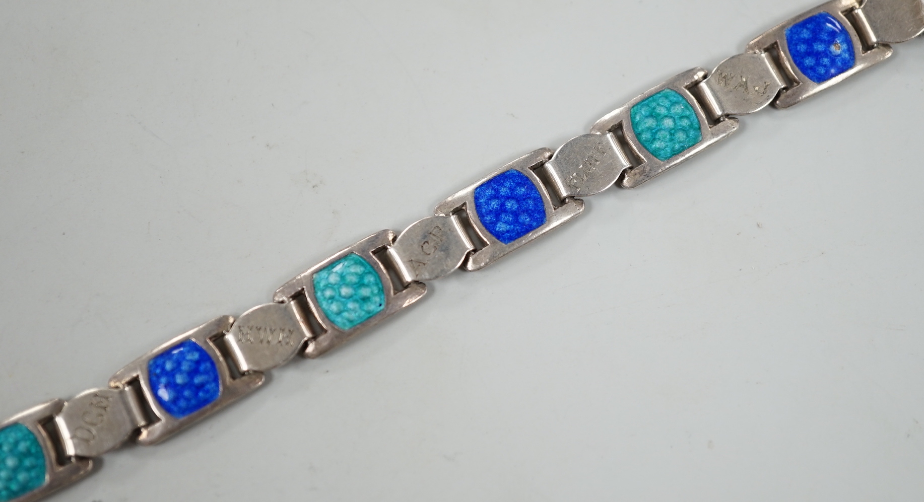 An Edwardian silver and two colour enamel bracelet, engraved with initials and words, 19cm.